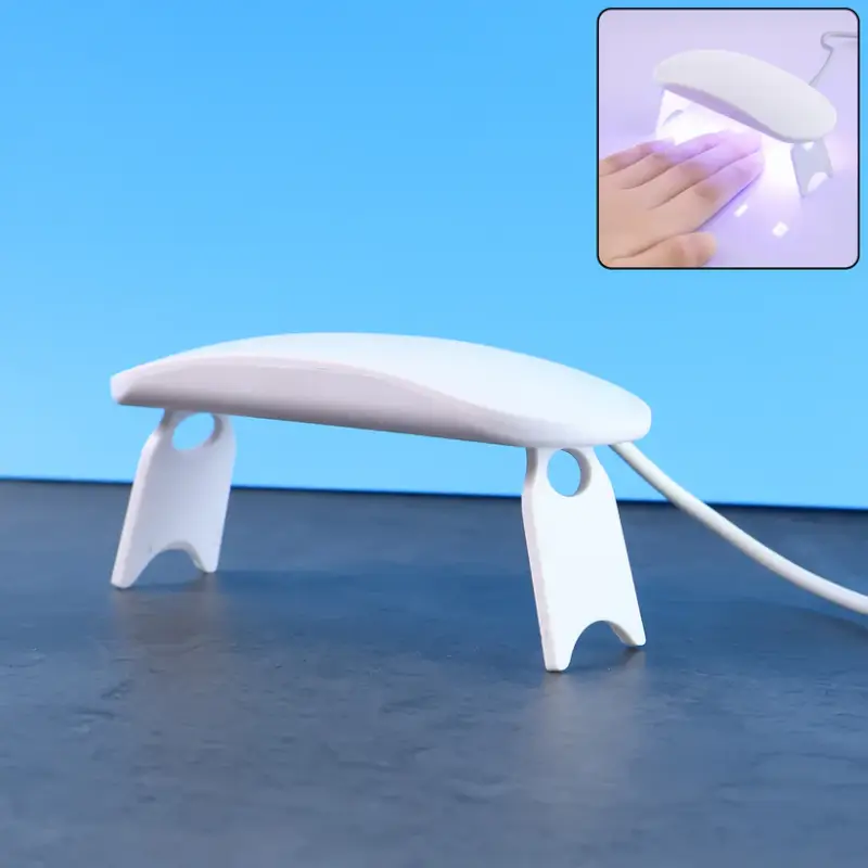 jvplc2m6UlqGVOYTv0qCTTcI484fKpiqVV6TlM0v.webp Mini Portable UV LED Nail Lamp USB Powered Gel Nail Polish Curing Dryer with Foldable Stand - Image 1